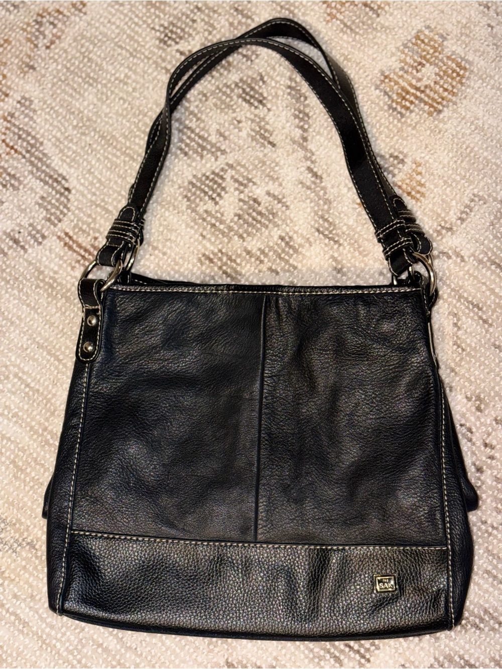 The Sak Black Leather Shoulder Bag with Silver Accents